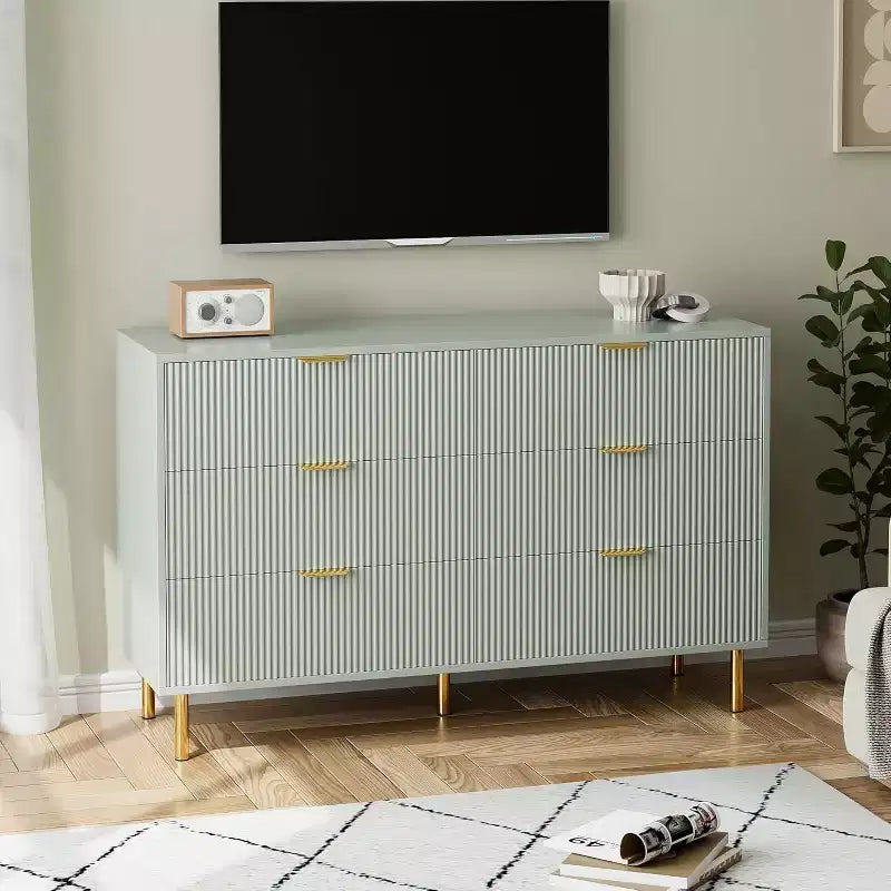 Six-drawer chest of drawers modern wooden storage unit with gold-tone metal handles and anti-tipping mechanism suitable for bedrooms living rooms.