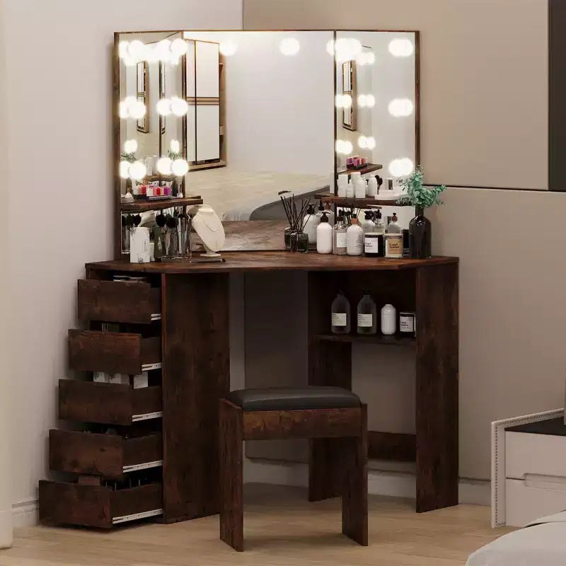 Coiffeuse d'angle avec miroir et éclairage offrant 3 couleurs de lumière réglables, 5 tiroirs et des étagères de rangement, complétée par une table de maquillage éclairée par LED.